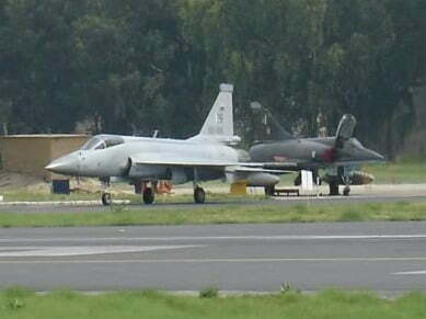 One_JF-17_in_front_of_two_parked_Mirage_5_cropped_version