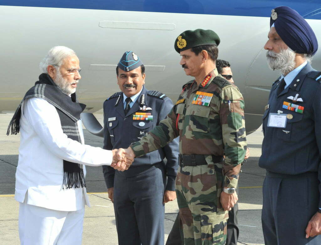Modi shaking hands with service chiefs