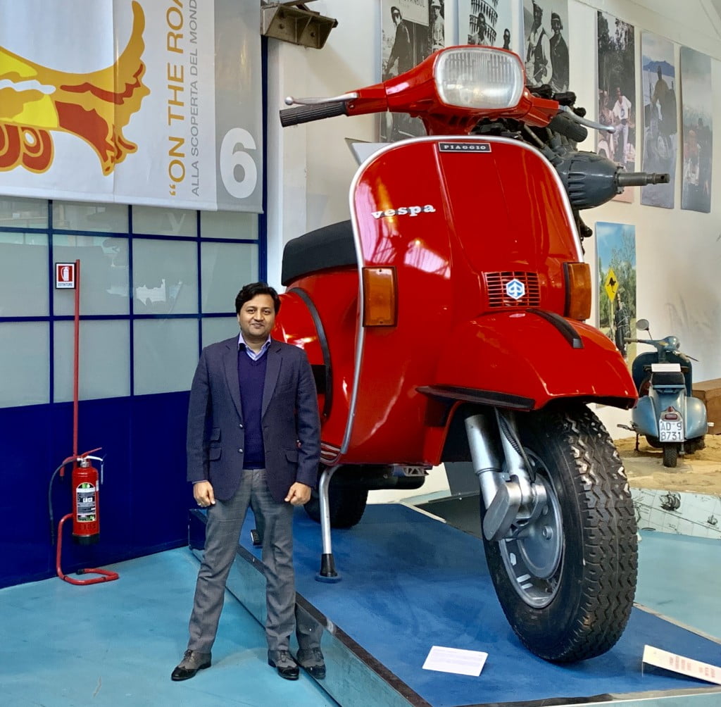 Vishal Singhal, Director, Advantek Fuel Systems in front of a scoter model
