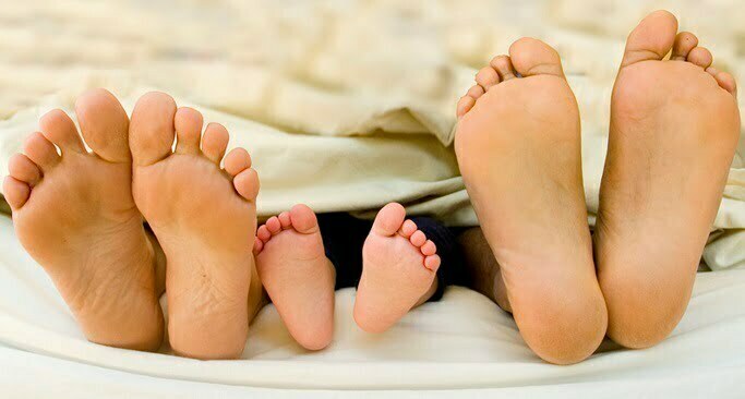 father mother and child feet